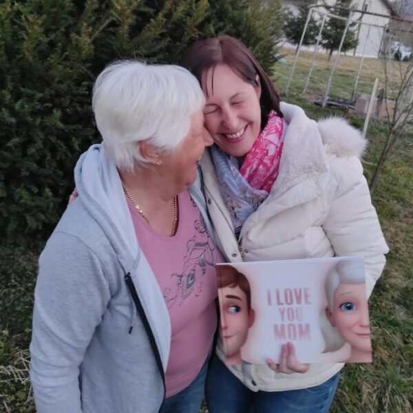 A mother and daughter bonding over a Hooray Heroes personalised book for Mums.